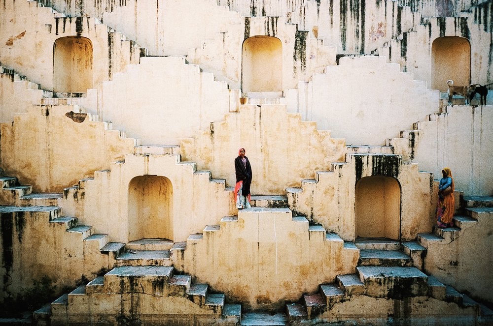 Figures on the steps of an Indian stepwell