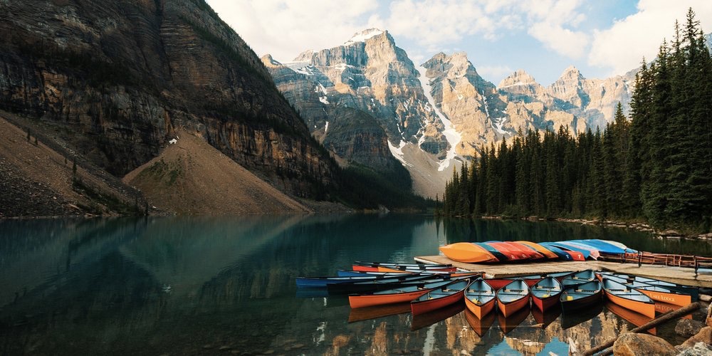 Canoes on a glacial lake, Canadian Rockies