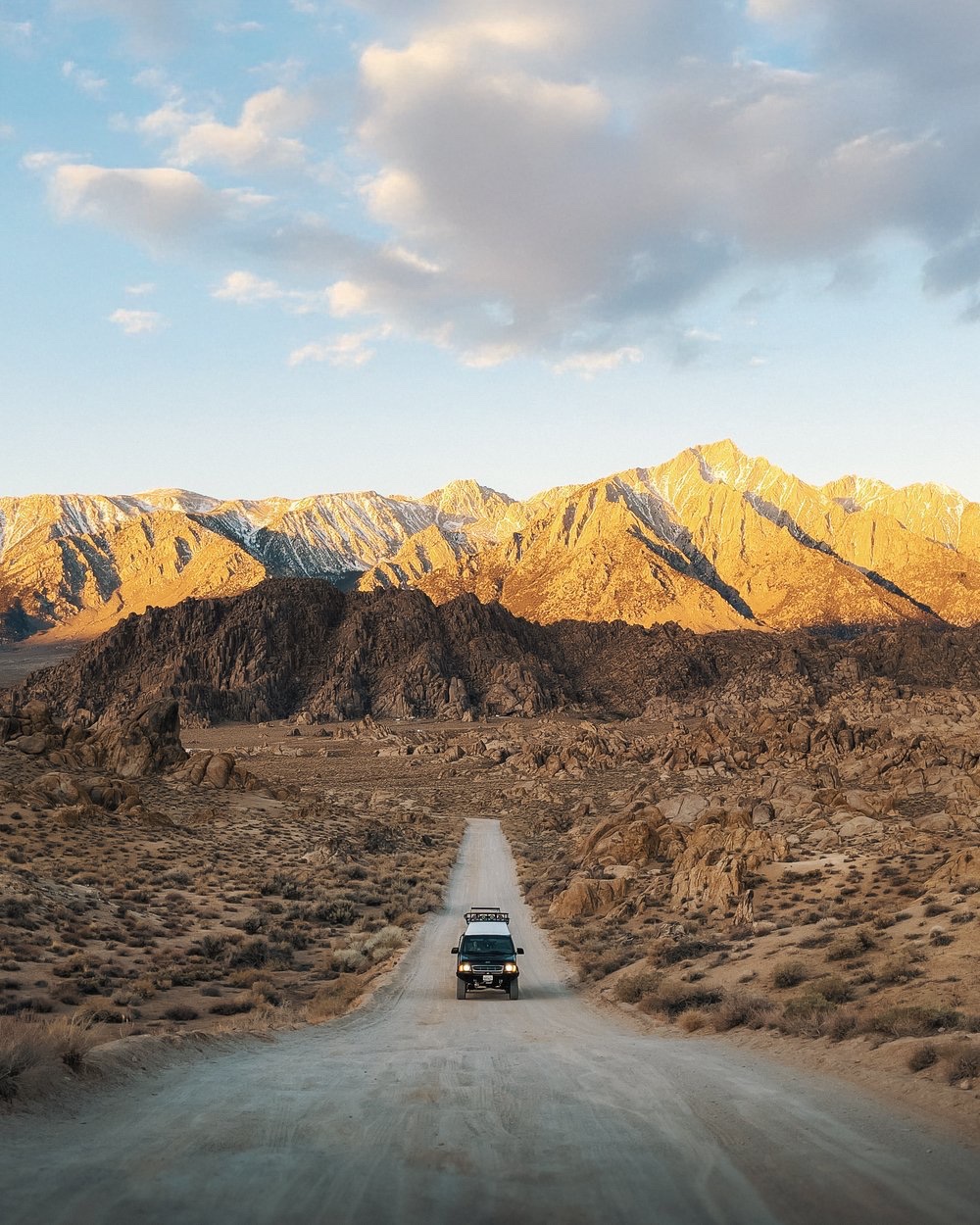 A desert road toward the mountains